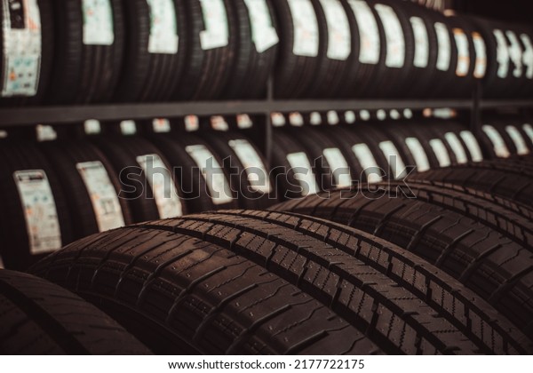 New tires\
on the shelves of tire service\
workshops.