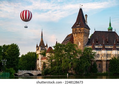 New touristic attraction in Budapest Hungary. The hot air ballon there is on the city park of Budapest. Near by famous Castle of Vajdahunyad and floating lake where you can try sporting with  paddle  - Powered by Shutterstock