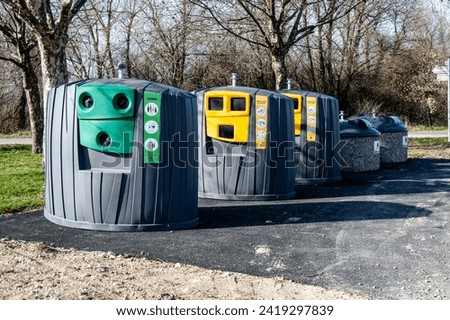 New trash container for selective sorting in France. For glass, paper, citizen waste. installation in the countryside