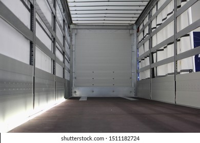 New Truck Empty Semi Trailer With Clean Floor, Inside Rear View Close-up, Lorry Transportation Logistics Business