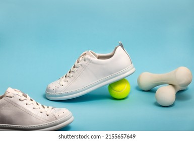 New Unbranded Fancy White Tennis Shoes On Blue Background New Unbranded Sneakers Or Trainers On Blue Background. Men's Sport Footwear. Pair Of Sport Shoes. Copy Space