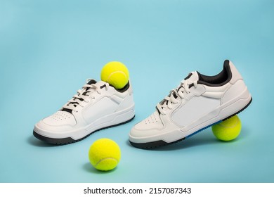 New Unbranded Fancy White Tennis Shoes On Blue Background New Unbranded Sneakers Or Trainers On Blue Background. Men's Sport Footwear. Pair Of Sport Shoes. Copy Space