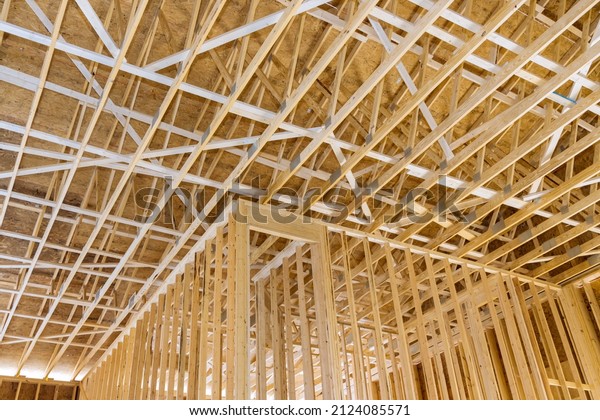 New under construction of framed a\
building with rafters roof beams the construction\
framework