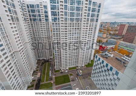 A new urban neighborhood in Moscow with tall modern residential buildings of 32 floors and a small courtyard with parking