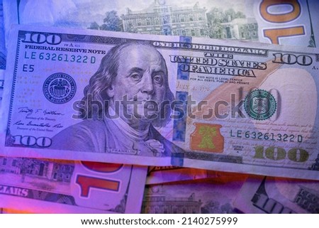 New US Dollar banknote. 100 USD bill on top of Dollar banknotes