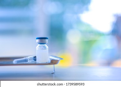 New vaccine covid-19 vial dose flu shot drug needle syringe,concept medical test vaccine coronavirus hypodermic injection treatment disease prevention immunization illness disease.selective focus.