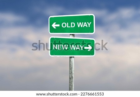 new way versus old way road sign, left and right direction sign on road, blue sky background
