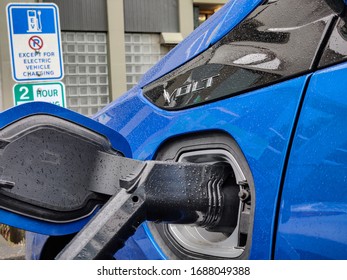 New Westminster, BC / Canada - March 28 2020: Chevy Volt Charging At A Public Charging Station