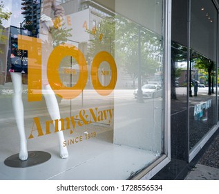 New Westminster, BC / Canada - May 9th 2020: A shot of an Army & Navy Store window decal signage on the front of their flagship location on historic Columbia Street in downtown New Westminster 