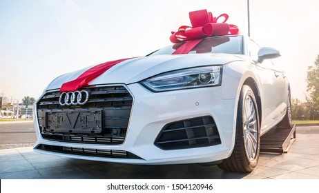 New White Car With Gift Ribbon And Bow. New Car Concept. Minsk, Belarus, 12/09/2019