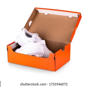 New White  Sneakers Shoes In Red Box. Taken At Studio And Isolated Over White Background