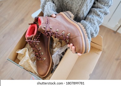 New Womens Leather Brown Waterproof Hiking Winter Autumn Boots In Hands Of Female, Trendy Footwear For Winter. Unpacking Shoes, Shopping Online From Home, Shoe Fashion Store