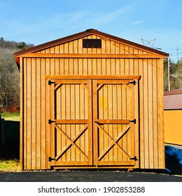 New Wood Shed On Display. The Shed Is Typically Used As Outdoor Storage And Commonly Installed In Home Backyard