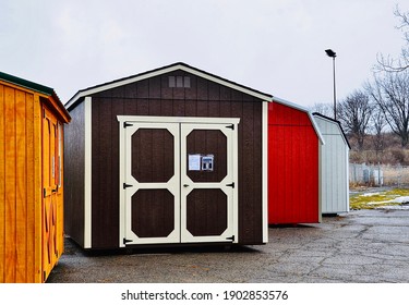 New Wood Sheds On Display. The Shed Is Typically Used As Outdoor Storage And Commonly Located In Home Backyard