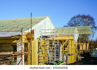 New Wooden Construction Building In The Construction Process, Roofing With Waterproofing Film