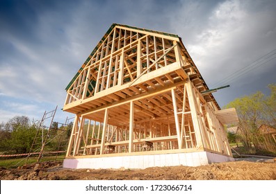 New wooden frame house under construction, outdoor residential home