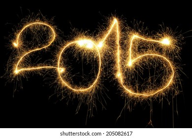 New Year 2015 formed from sparking digits over black background - Powered by Shutterstock