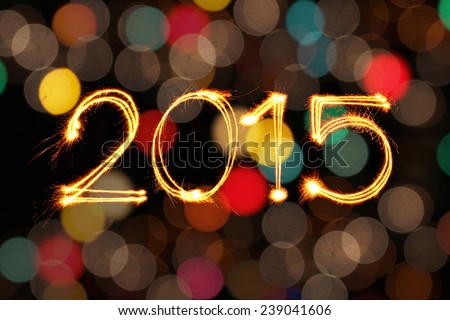 New year 2015 sparkles firework with dirty defocused light blur bokeh background