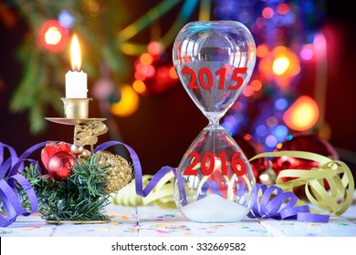 New Year 2016 concept with hourglass and Christmas decoration