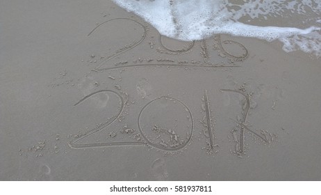 New Year 2017 replace 2016 on sea beach summer, New Year 2017 is coming concept. Closeup.

