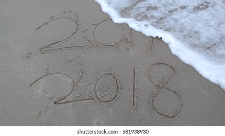 New Year 2018 replace 2017 on sea beach summer, New Year 2018 is coming concept. Closeup.


