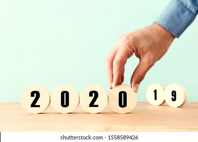 New Year 2020 Concept. Business Idea Over Wooden Board