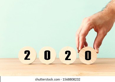 New Year 2020 Concept. Business Idea Over Wooden Board