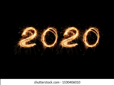 New Year 2020 light. Sparklers draw figures 2020. Bengal lights and letter - Powered by Shutterstock