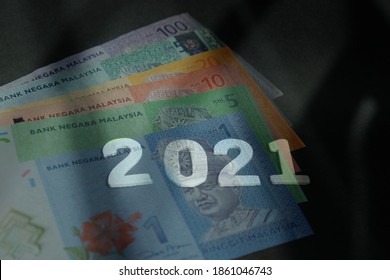  New Year 2021 And Ringgit Malaysia (MYR) As Background. Concept For Finance, Economy, Budget And Investment.