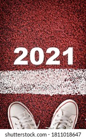 New Year 2021 And Starting Line On Red Sport Track. Business Success Concept And Challenge Idea