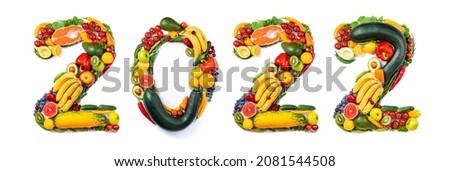 New year 2022 food trends. New Year 2022 made of vegetables, fruits and fish on white background. Number 2022 healthy food. 2022 resolutions, trends, balanced food, sustainable, healthy food concept