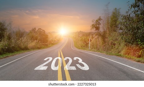 New year 2023 forward concept. Word 2023 written on the asphalt road at sunset sky. Concept of planning, challenge and goal. - Shutterstock ID 2227325013