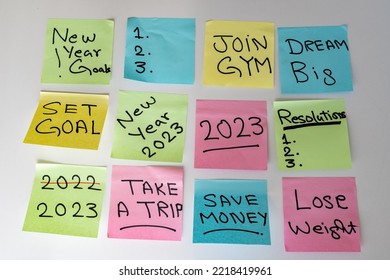 New Year 2023 goals hand written on a sticky notes on a white isolated background - Shutterstock ID 2218419961