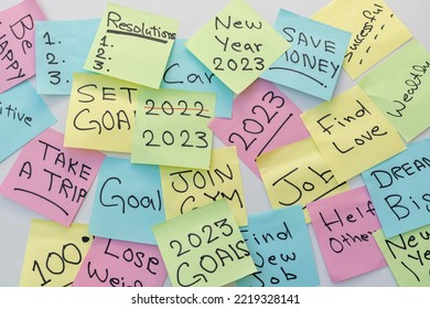 New year 2023 goals and resolutions written on a colorful sticky notes - Shutterstock ID 2219328141