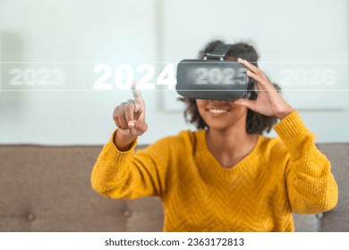 New year 2024 idea African American teenage woman using  Virtual Reality Glasses  and creative on  New Goals, Plans, planning to countdown strategy and motivation in new year 