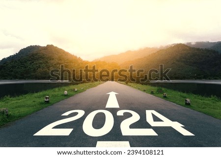 The new year 2024 or straightforward concept. Text 2024 written on the asphalt road at sunset. planning and challenge, business strategy, opportunity, hope, new life, and sustainability environment.
