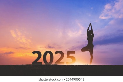 New year 2025 healthy concept, Silhouette fitness woman yoga with sunset sky background - Powered by Shutterstock