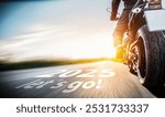 New year 2025 or start straight and beginning concept. Man ride on a motorbike, the number 2025 lets go written on the road.