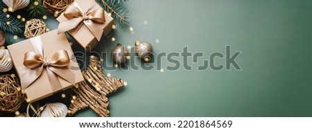 New Year banner with Christmas gift boxes and golden decorations on khaki background.