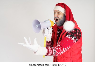 New Year And Christmas Concept. Santa Claus Is Emotionally Talking Through The Loudspeaker.