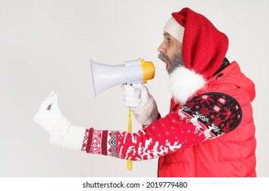 New Year And Christmas Concept. Santa Claus Is Emotionally Talking Through The Loudspeaker.