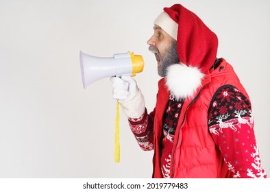 New Year And Christmas Concept. Santa Claus Is Emotionally Talking Through The Loudspeaker.