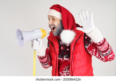 New Year And Christmas Concept. Santa Claus Is Emotionally Talking Through The Loudspeaker.