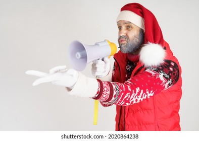 New Year And Christmas Concept. Santa Claus Is Emotionally Talking Through The Loudspeaker.