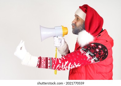 New Year And Christmas Concept. Santa Claus Is Emotionally Talking Through The Loudspeaker.