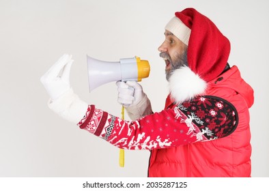 New Year And Christmas Concept. Santa Claus Is Emotionally Talking Through The Loudspeaker.