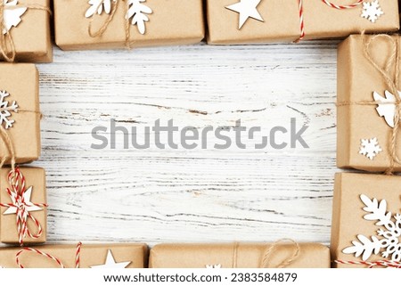 New Year and Christmas Frame Composition. handmade wrapped christmas gift boxes with decoration on white background with empty copy space for your text. above view, flat lay.