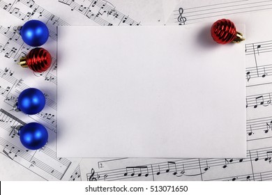 New Year Composition Christmas Tree Decorations On The Table And Sheet With Music Notes