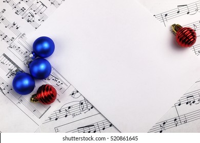 New Year Composition Christmas Tree Decorations On The Table And Sheet With Music Notes