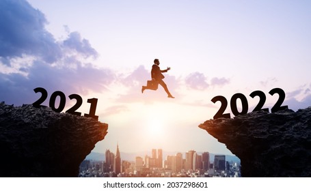 New year concept of 2022. Jumping businessman. New year card. - Shutterstock ID 2037298601